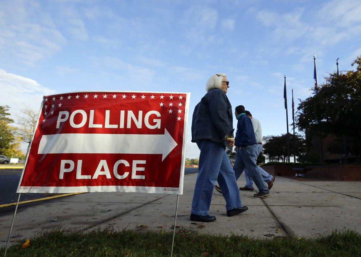 Voters arrive and depart during early voting at a polling place at the Wicomico County Youth and Civic Center in Salisbury, Md., Wednesday, Oct. 31, 2012, after superstorm Sandy passed through the area. Early voting resumed in Maryland Wednesday after two days of cancellations due to superstorm Sandy. (AP Photo/Alex Brandon)