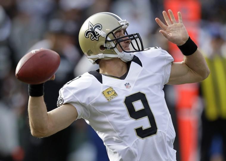 New Orleans Saints quarterback Drew Brees drops back to pass during the second quarter of an NFL football game against the Oakland Raiders in Oakland, Calif., Sunday, Nov. 18, 2012. (AP Photo/Ben Margot)
 