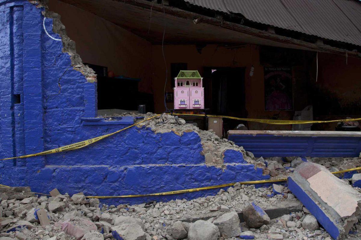 A dollhouse is seen inside a damaged house after a magnitude 7.4 earthquake that struck in San Marcos, Guatemala, Wednesday, Nov. 7, 2012. The mountain village, some 80 miles (130 kilometers) from the epicenter, suffered much of the damage with some 30 homes collapsing in its center. There are three confirmed dead and many missing after the strongest earthquake to hit Guatemala since a deadly 1976 quake that killed 23,000. (AP Photo/Moises Castillo)