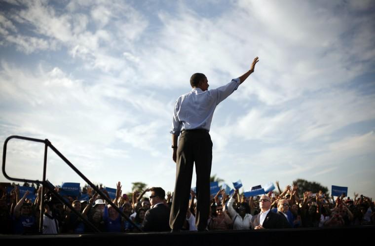 President Barack Obama waves to supporters during a campaign event at McArthur High School, Sunday, Nov. 4, 2012, in Hollywood, Fla. (AP Photo/Pablo Martinez Monsivais)
 