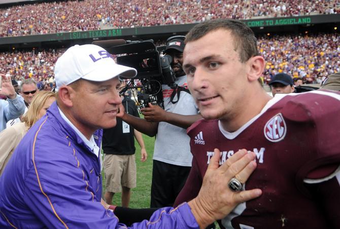 LSU football coach Les Miles congratulates Texas A&amp;M freshman quaterback Johnny Manziel (2) after the game on Saturday. Oct. 20, 2012.