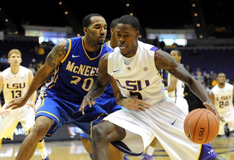 LSU forward Shavon Coleman dribbles past McNeese State forward Adrian Fields Tuesday, Nov. 13, 2012 during the Tigers' game against McNeese State in the Pete Maravich Assembly Center.
 