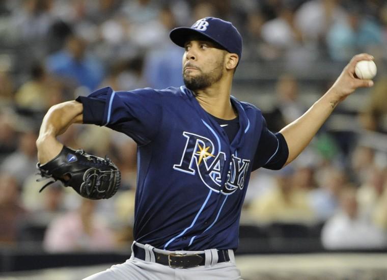 FILE - This Sept. 14, 2012 file photo shows Tampa Bay Rays starting pitcher David Price throwing against the New York Yankees in the first inning of a baseball game at Yankee Stadium in New York. Price and 2011 winner Justin Verlander are among the finalists for this year's AL Cy Young Award, Wednesday, Nov. 14, 2012.(AP Photo/Kathy Kmonicek, File)
 