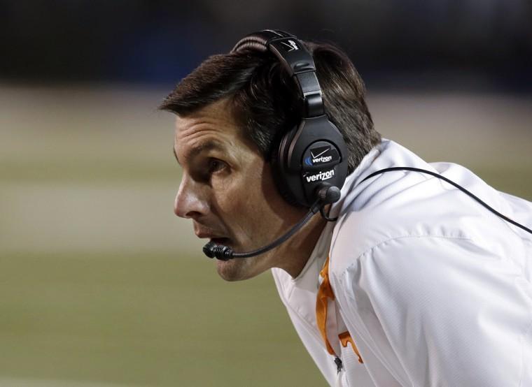 Tennessee head coach Derek Dooley watches during the second quarter of an NCAA college football game against Vanderbilt, Saturday, Nov. 17, 2012, in Nashville, Tenn. (AP Photo/Mark Humphrey)
 