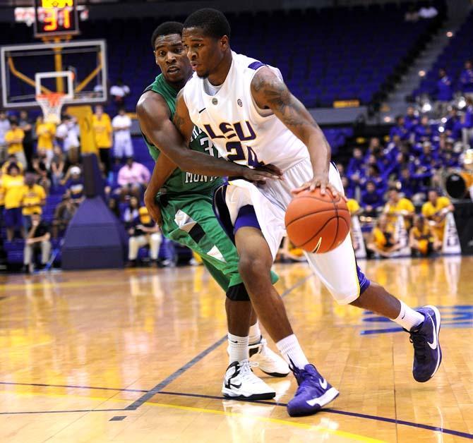 LSU freshman guard Malik Morgan (24) moves past an Arkansas-Monticello defender during the Tigers' 82-66 victory over the Boll Weevils Monday Nov. 5, 2012 in the PMAC.
 