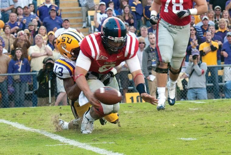 In this file photo, former LSU cornerback Ron Brooks (13) causes Ole Miss&#8217;
former quarterback, Jeremiah Masoli (8), to fumble the ball November 20,
2010, during the Tigers&#8217; 43-36 victory against Ole Miss. LSU will host Ole Miss on Saturday.
 