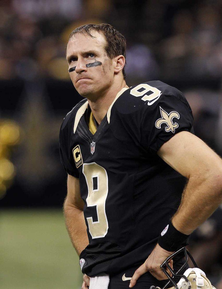 New Orleans Saints quarterback Drew Brees (9) watches the scoreboard during the closing moments in the second half of an NFL football game against the San Francisco 49ers in New Orleans, Sunday, Nov. 25, 2012. The 49ers won 31-21. (AP Photo/Bill Haber)