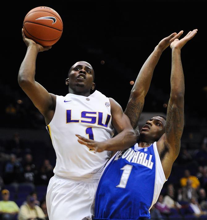 LSU sophomore guard Anthony Hickey (1) moves past Seton Hall guard Aaron Cosby (1) to make a shot Thursday, Nov. 29, 2012, during the Tigers' 72-67 victory against the Pirates in the PMAC.