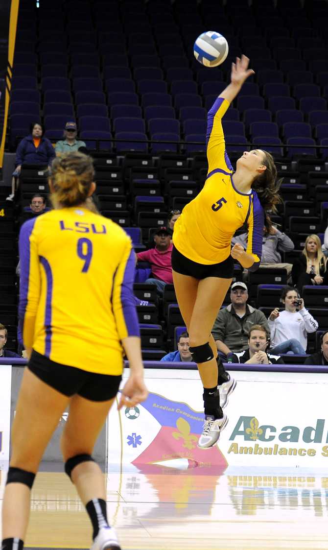 LSU sophomore middle blocker Marissa Maas (5) spikes the ball on Sunday, Oct. 28, 2012 in the PMAC for the SEC match-up game between LSU and Mississippi State.