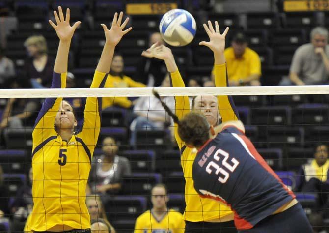 Sophomore middle blocker Marissa Maas (5) and Senior outside hitter/right ride Madie Jones (6) block the ball Sunday, November 4, 2012 during the Tigers' 3-2 victory versus Ole Miss.