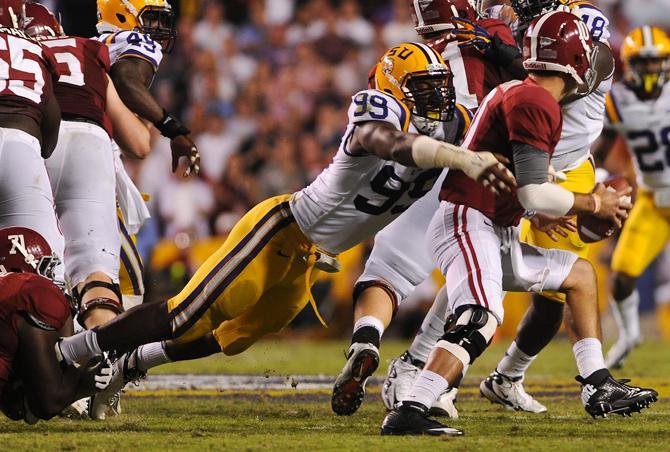 LSU junior defensive end Sam Montgomery (99) sacks Alabama quarterback AJ McCarron (10) Saturday, Nov. 3, 2012, during the Tigers' 21-17 loss to the Crimson Tide in Tiger Stadium.