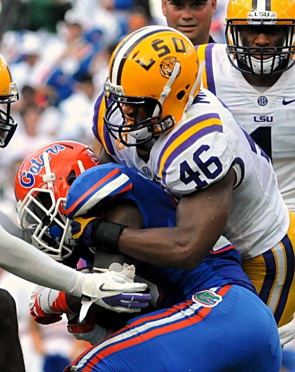 LSU junior linebacker Kevin Minter (46) makes a tackle Saturday, Oct. 6, 2012 during the Tigers' 14-6 loss to the Gators in Ben Hill Griffin Stadium in Gainesville. Minter had a career-high 20 tackles including two sacks during the game.