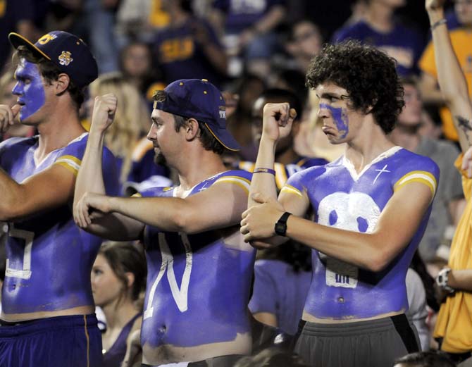 The painted posse cheers at the front of the student section Saturday, Sept. 15, 2012 during the Tigers' 63-14 win over Idaho in Tiger Stadium.