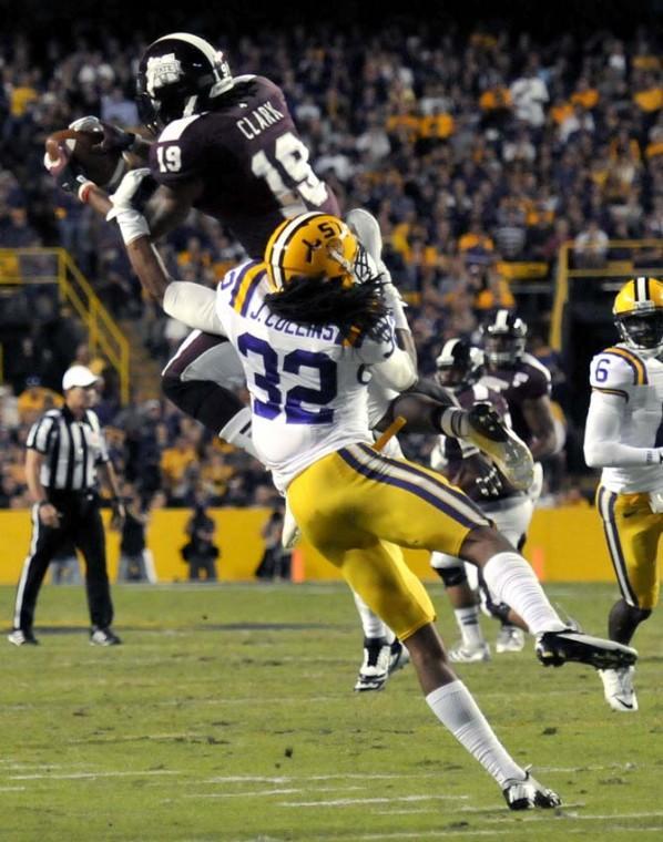 <p>LSU freshman cornerback Jalen Collins tackles MSU senior wide receiver Arceto Clark during the Tiger's 37-17 win over the Bulldogs on November 10, 2012.</p>