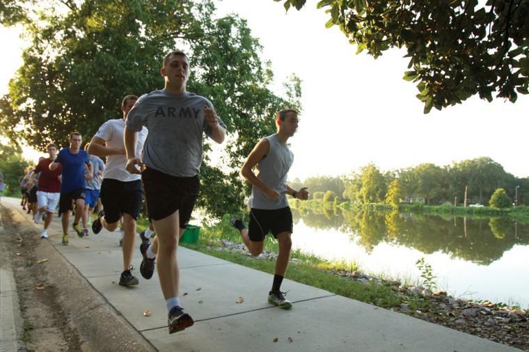 Students start a two mile run Friday morning during a fitness test for ROTC Freshman Orientation.
 