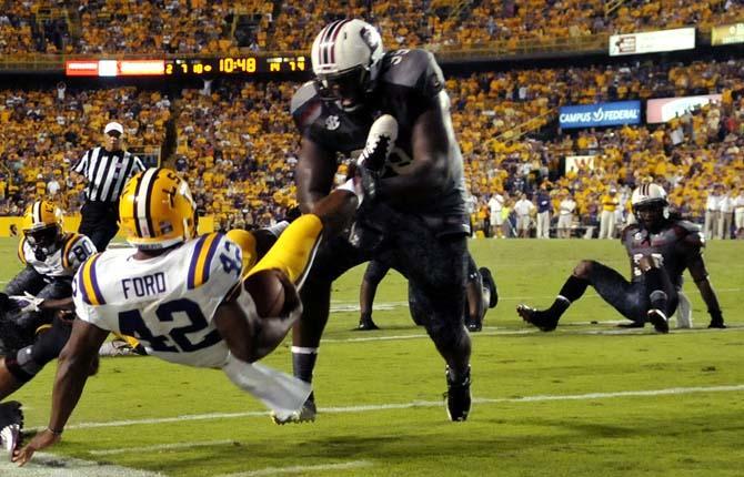 Jeremy Hill's two touchdowns lead Tigers to 23-21 victory