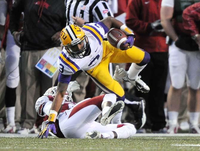 LSU sophomore wide receiver Odell Beckham Jr. (3) hurdles an Arkansas defender during the Tiger's 20-13 win over the Razorbacks on November 23, 2012.
 