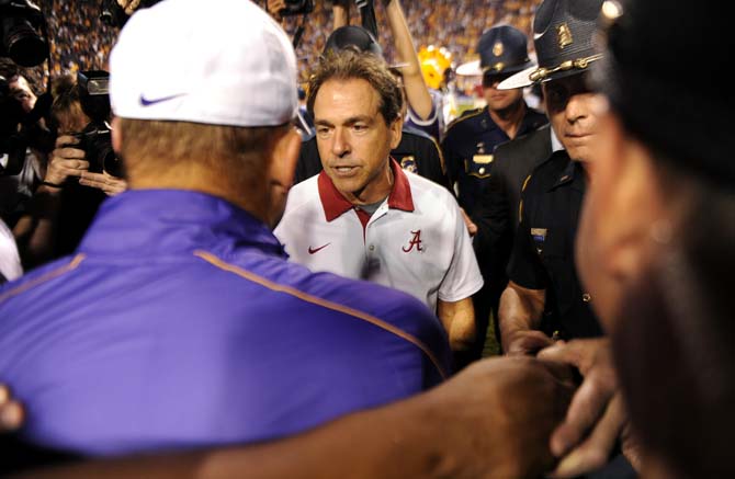 LSU head coach Les Miles and Alabama head coach Nick Saban shake hands Saturday, Nov. 3, 2012 after the Tigers' 21-17 loss against Alabama in Tiger Stadium.