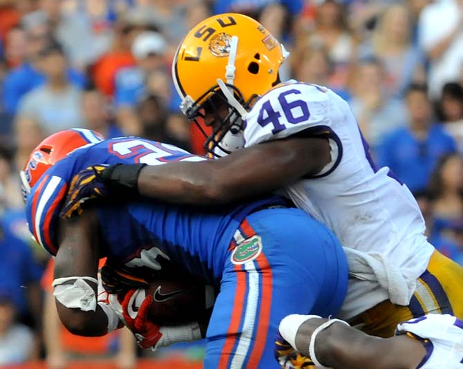 LSU junior linebacker Kevin Minter (46) makes a tackle Saturday, Oct. 6, 2012 during the Tigers' 14-6 loss to the Gators in Ben Hill Griffin Stadium in Gainesville. Minter had a career-high 20 tackles including two sacks during the game.