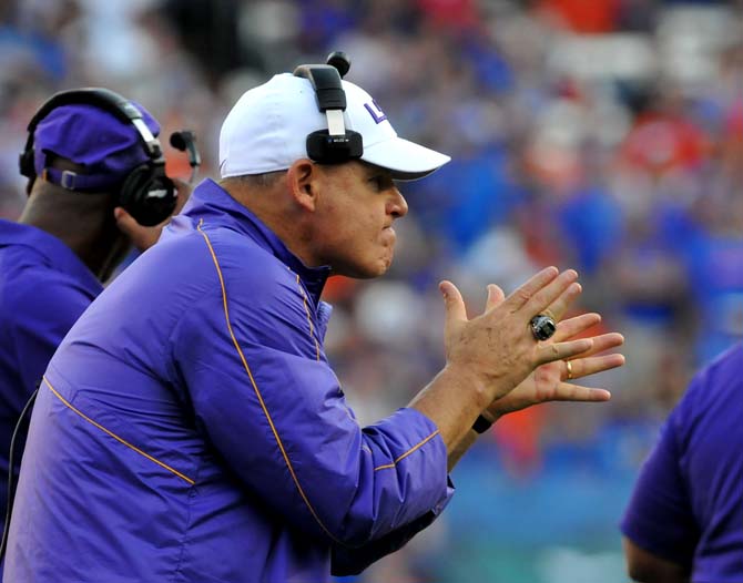 LSU head coach Les Miles cheers on the players Saturday, Oct. 6, 2012 during the Tigers' 14-6 loss to the Gators in Ben Hill Griffin Stadium in Gainesville.