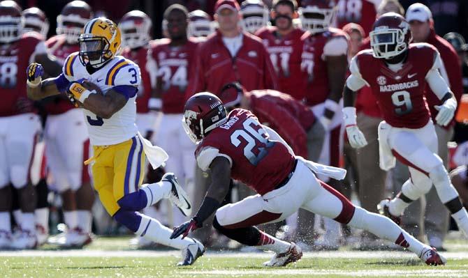 LSU sophomore wide receiver Odell Beckham Jr. (3) eludes Arkansas tacklers during the Tiger's 20-13 win over the Razorbacks on Novembre 23, 2012.