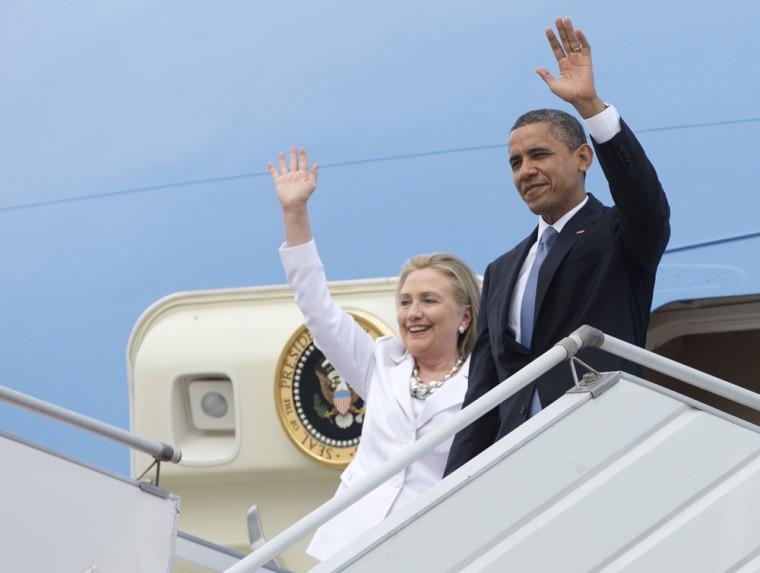 U.S. President Barack Obama and Secretary of State Hillary Rodham Clinton wave as they arrive at Yangon International Airport in Yangon, Myanmar, on Air Force One, Monday, Nov. 19, 2012. This is the first visit to Myanmar by a sitting U.S. president. (AP Photo/Carolyn Kaster)