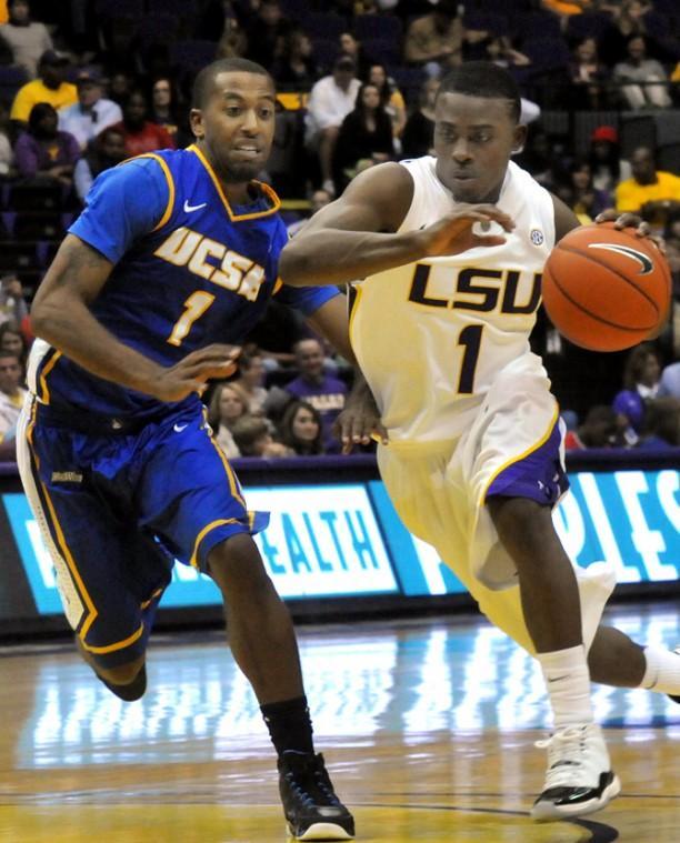 LSU sophomore guard Anthony Hickey (1) drives past UCSB senior guard Nate Garth (1) on Friday, Nov. 9, 2012 in the 77-63 win over the University of California, Santa Barbara in the PMAC.