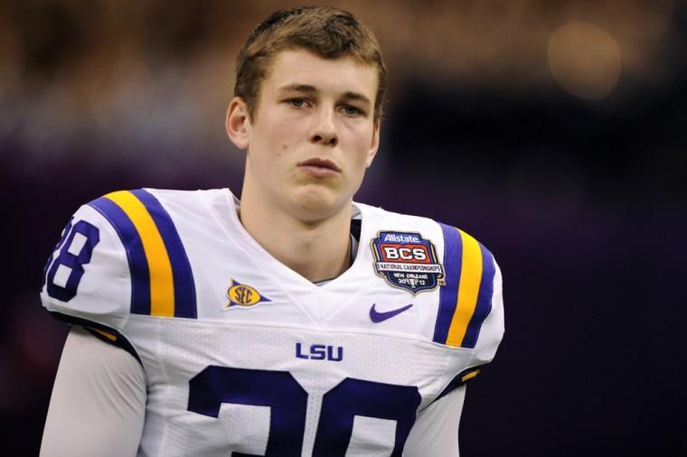 LSU then-freshman punter Brad Wing tearfully watches Alabama players and fans celebrate their Allstate BCS National Championship win Jan. 9, 2012.