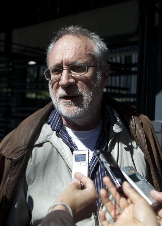 Mexican poet Javier Sicilia, leader of the Movement for Peace with Justice and Dignity, speaks to reporters after delivering a letter at the U.S. Embassy, urging President Obama for tighter controls against gun smuggling into Mexico, in Mexico City, Monday, Jan. 14, 2013. (AP Photo/Eduardo Verdugo)
 