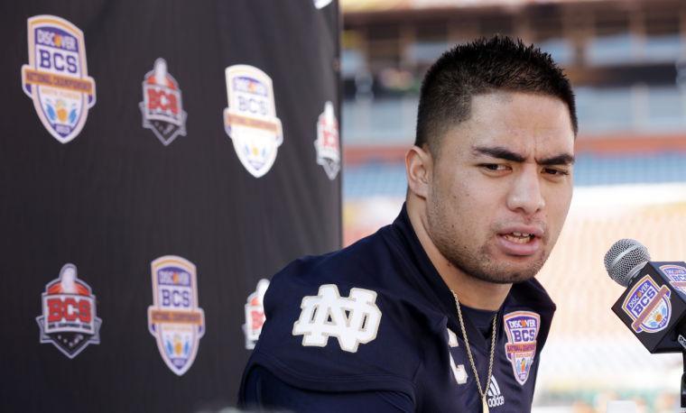 Notre Dame linebacker Manti Te'o answers a question during Media Day for the BCS National Championship college football game Saturday, Jan. 5, 2013, in Miami. Notre Dame faces Alabama in Monday's championship game. (AP Photo/David J. Phillip)
 