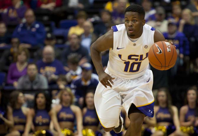 Andre Stringer (10), LSU junior guard, runs the ball Tuesday, Dec. 11, during the LSU vs. Chattanooga game.