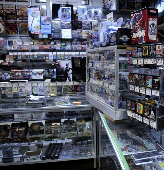 Books, playing cards, action figures, and other items fill the counter and walls of Louisiana's Double Play, the only comic book shop in Baton Rouge, Tuesday, Jan. 29, 2013.
 