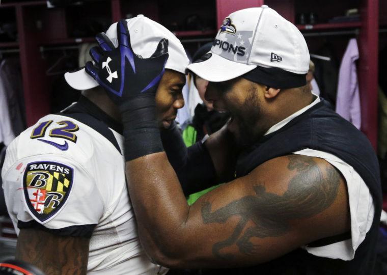 Baltimore Ravens inside linebacker Ray Lewis, right, and Jacoby Jones (12) celebrate in the team's locker room after the NFL football AFC Championship game against the New England Patriots in Foxborough, Mass., Sunday, Jan. 20, 2013. The Ravens won 28-13 to advance to Super Bowl XLVII. (AP Photo/Elise Amendola)
 