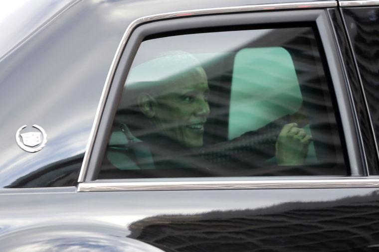 President Barack Obama is seen inside his armored limousine as he first lady Michelle Obama finish the inaugural parade during the 57th Presidential Inauguration in Washington, Monday, Jan. 21, 2013. (AP Photo/Charles Dharapak)
 