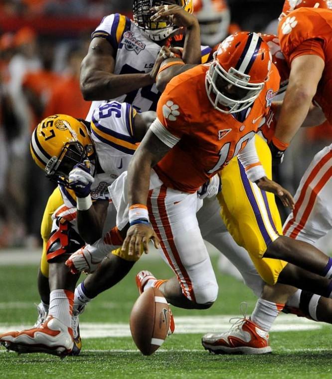 LSU junior linebacker Tahj Jones (58) sacks Clemson quarterback Tajh Boyd (10) Monday, Dec. 31, 2012 during the Tigers' 24-25 loss in the Chick-fil-A Bowl against Clemson in Atlanta, Ga.
 