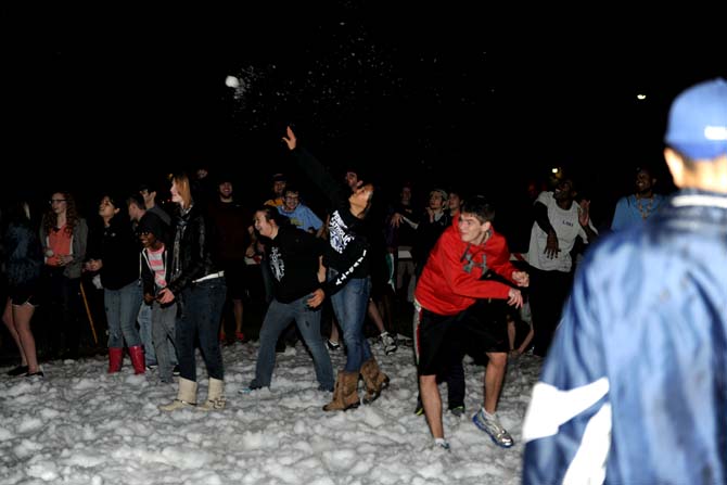 Students throw snowballs at each other Monday, Jan. 28, 2013. There were 7 tons of snow delivered to the parade grounds for this event.
 