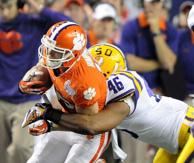 LSU junior linebacker Kevin Minter (46) tackles Clemson wide receiver Adam Humphries Monday, Dec. 31, 2012 during the Tigers' 24-25 loss in the Chick-fil-A Bowl against Clemson in Atlanta, Ga.
 