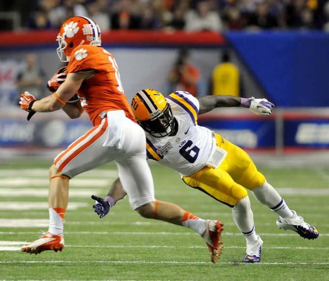 LSU junior safety Craig Loston (6) dives toward a Clemson player Dec. 31, 2012 during LSU's 24-25 Chick-fil-A Bowl loss in Atlanta, Ga.
 