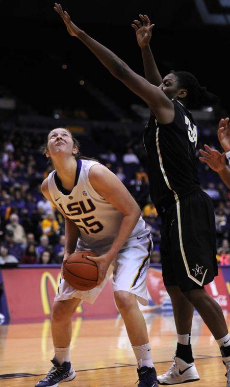 LSU junior forward Theresa Plaisance (55) looks around a defender at the goal Sunday, Jan. 20, 2013 during the 54-51 victory over the Vanderbilt Commodores in the PMAC.
 