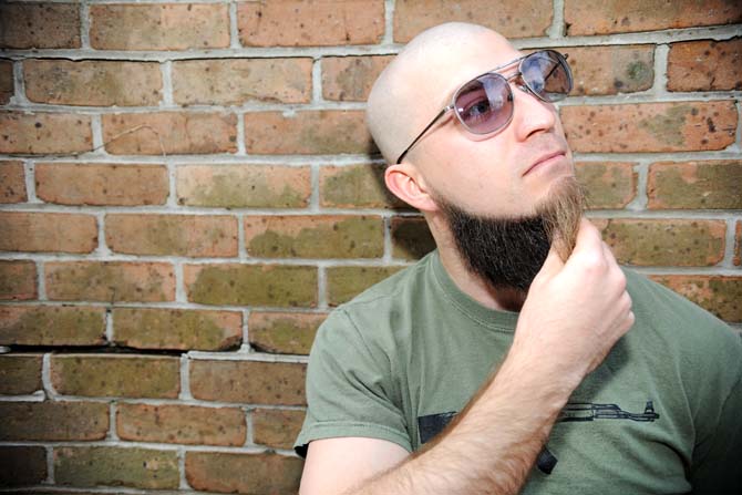 Russ Andre, 29, poses Sunday Jan. 27, 2013 outside of the design building on campus.
 