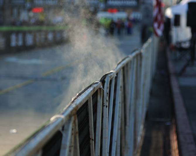 In the cold of the early morning, steam rises off the guard rail separating the runners from the spectators at the LA Marathon downtown on Jan. 20, 2013.
 