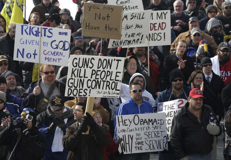 Gun-rights advocates gather outside the Utah Capitol during the National Gun Appreciation Day Rally Saturday, Jan. 19, 2013, in Salt Lake City. Gun owners and Second Amendment advocates rallied in state capitals nationwide Saturday, days after President Barack Obama unveiled a sweeping package of federal gun-control proposals. (AP Photo/Rick Bowmer)
 