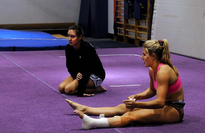 Sports administration major Sarie Morison, a member of LSU's gymnastics team, wraps her ankle Monday, Jan. 28, 2013.
 