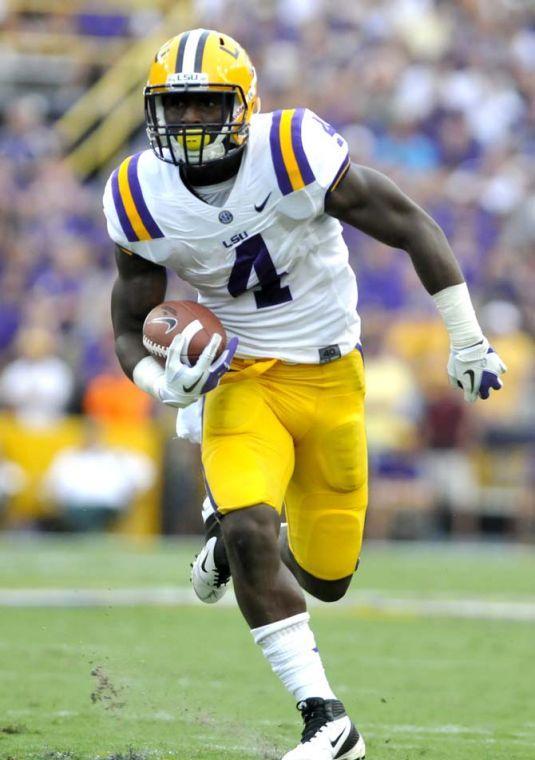 LSU junior running back Alfred Blue (4) runs the football into the endzone for a touchdown Saturday Sept. 8, 2012 during the Tigers' 41-3 victory over the Washington Huskies in Tiger Stadium.
 