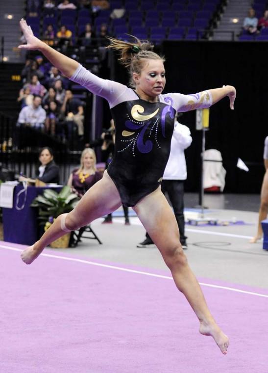 LSU junior all-around Kaleigh Dickson jumps through the air Jan. 4, 2013 during the Tiger's 196-194 win over NC State in the PMAC.
 