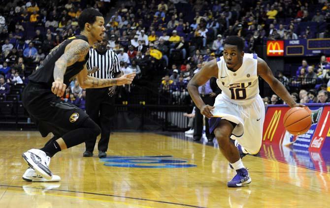 LSU junior guard Andre Stringer (10) prepares to move around Missouri freshman guard Negus Webster-Chan (14) during the Tigers' 73-70 victory against Mizzou Wednesday Jan. 30, 2013 in the PMAC.
 