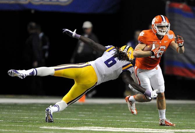 LSU junior safety Craig Loston (6) tackles Clemson wide receiver Adam Humphries Monday, Dec. 31, 2012 during the Tigers' 24-25 loss in the Chick-fil-A Bowl against Clemson in Atlanta, Ga.
 