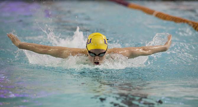 LSU senior Sally Wood takes a breath during the butterfly portion of her 400 yard IM race during the girls meet against Houston, Rice, and Tulane in the Natatorium on Jan. 26, 2013.
 