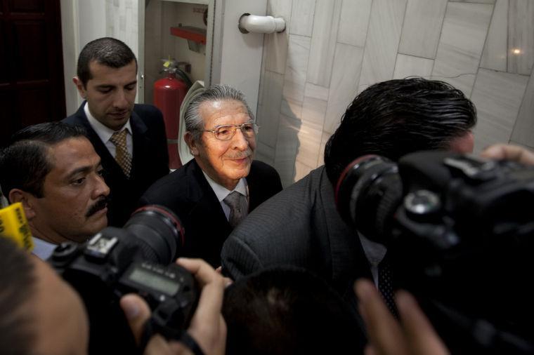 Guatemala's former dictator Jose Efrain Rios Montt, third from left, leaves after attending his hearing in Guatemala City, Monday, Jan. 28, 2013. Rios Montt, a former U.S.-backed dictator who presided over one of the bloodiest periods of Guatemala's civil war, will stand trial on charges he ordered the murder, torture and displacement of thousands of Mayan Indians, a judge ruled Monday. (AP Photo/Moises Castillo)
 