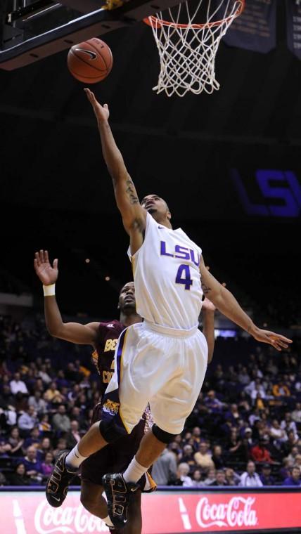 Corban Collins (4), LSU freshman guard, shoots the ball Saturday, Jan. 5, during the LSU vs. Bethune Cookman game.
 